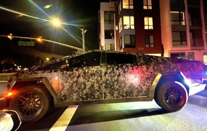 Digital camo Cybertruck in night time driving sighting [video]