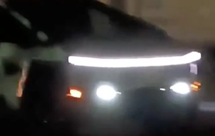 Video: Camo'd Cybertruck with lights on at night (headlight bar, fog lights, turn signals, rear light bar)