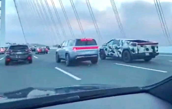 Camo Cybertruck looks awesome on bridge vs. regular cars + good Rivian size comparison! (8/25 video) 😍