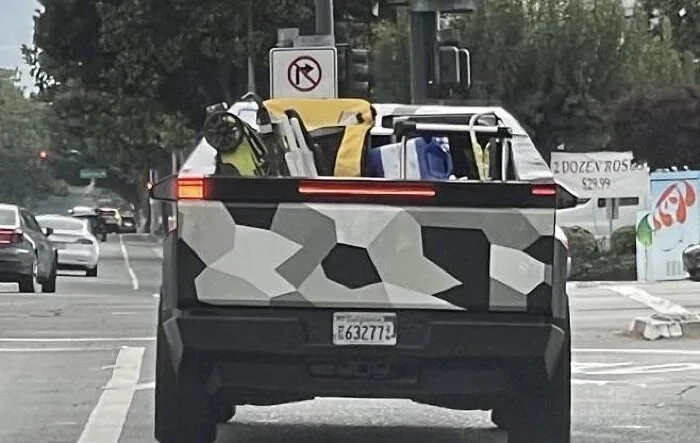 Spotted: Cybertruck bed vault hauling beach chairs, lawn mower and gear