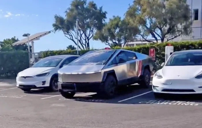 Cybertruck reverse parks at supercharger; shows size vs. Model X & Model Y