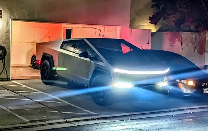 Cybertruck parked at garage (shows vault bed lights!)