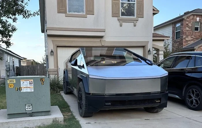 Cybertruck parked in (test driver's?) house driveway and showing excellent fit & finish