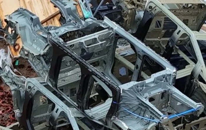 Bottom side of Cybertruck body-in-white BIW with Giga castings attached